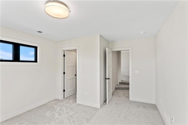 7015 Forest Lks, Parkville, MO 64152 - unfurnished bedroom featuring light colored carpet and baseboards