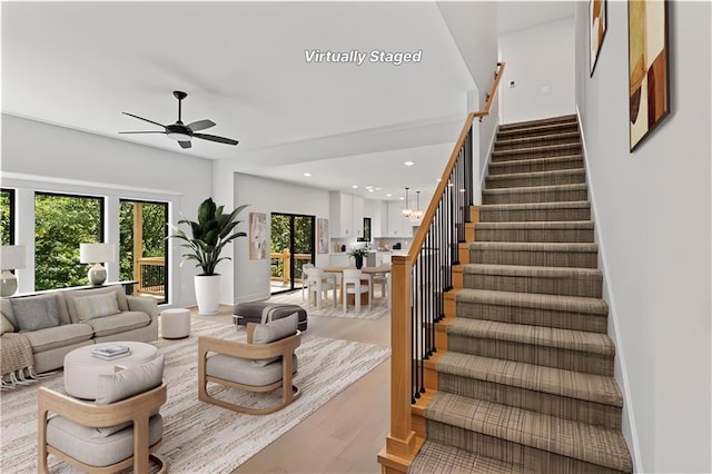 7015 Forest Lks, Parkville, MO 64152 - living room featuring ceiling fan, stairway, light wood-style flooring, recessed lighting, and baseboards