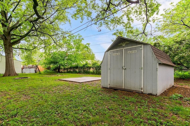 view of shed with fence