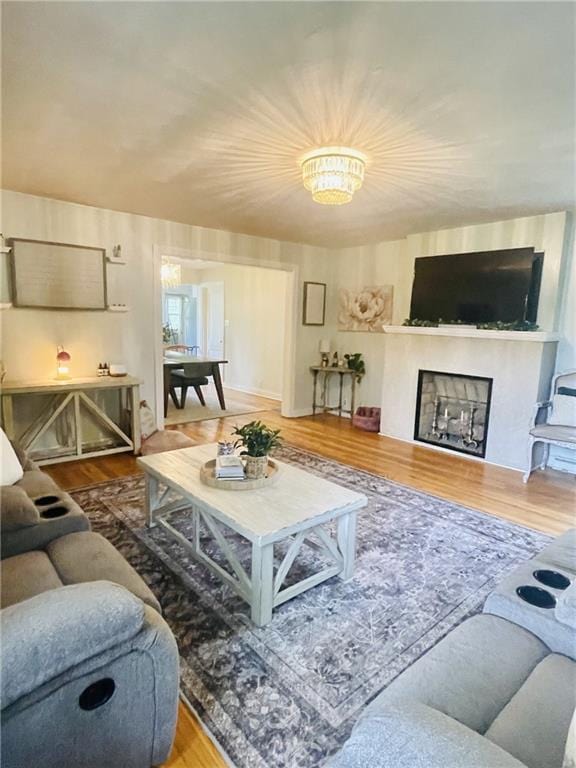 336 E Park St, Olathe, KS 66061 - living area featuring wood finished floors and a fireplace