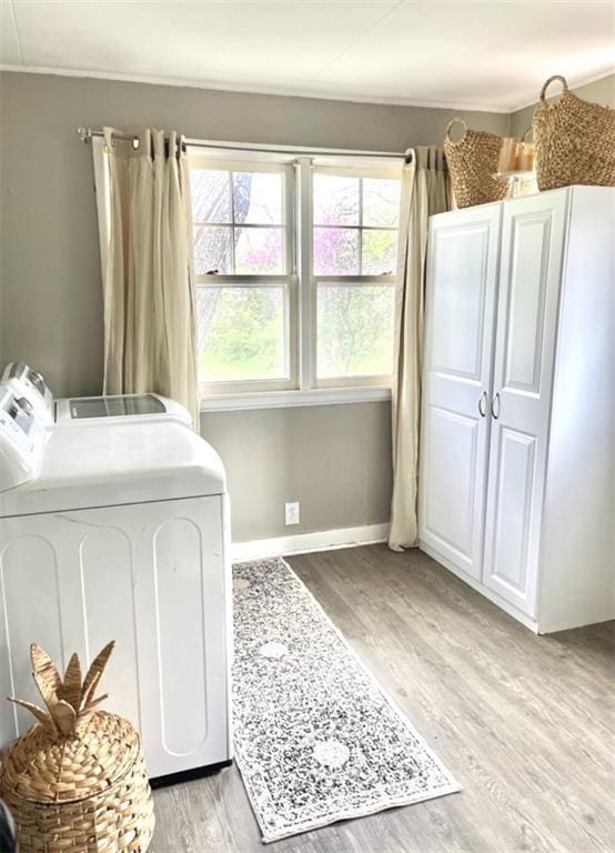 336 E Park St, Olathe, KS 66061 - clothes washing area featuring light wood-style flooring, independent washer and dryer, and baseboards