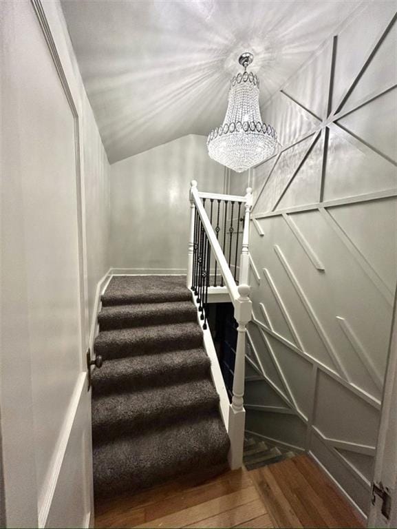 336 E Park St, Olathe, KS 66061 - stairs with a chandelier, wood-type flooring, and vaulted ceiling
