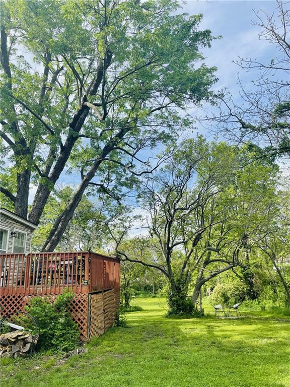336 E Park St, Olathe, KS 66061 - view of green lawn with a deck