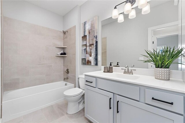 bathroom featuring vanity, toilet, washtub / shower combination, tile patterned floors, and a notable chandelier