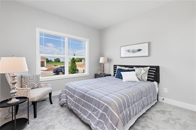 bedroom featuring carpet floors and baseboards