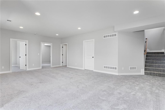 unfurnished living room featuring visible vents and carpet
