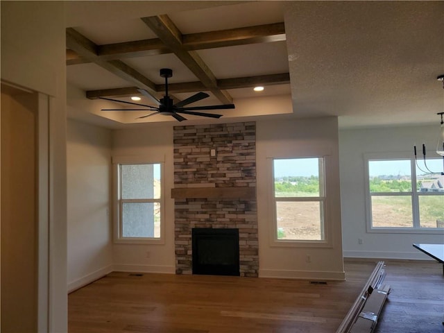 17122 W 168th Pl, Olathe, KS 66062 - unfurnished living room with a ceiling fan, coffered ceiling, wood finished floors, a chandelier, and a fireplace
