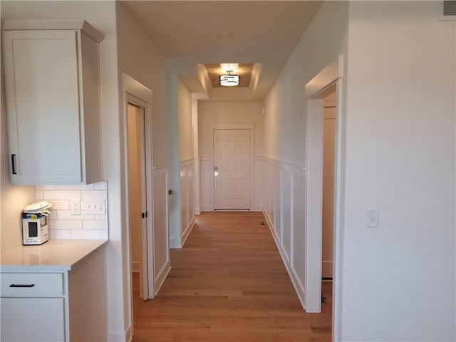 17122 W 168th Pl, Olathe, KS 66062 - hallway featuring light wood-style flooring and a wainscoted wall