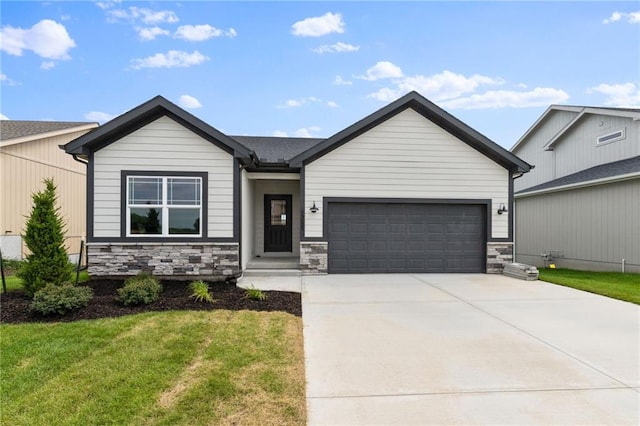17122 W 168th Pl, Olathe, KS 66062 - view of front of home featuring a garage, driveway, stone siding, and a front yard