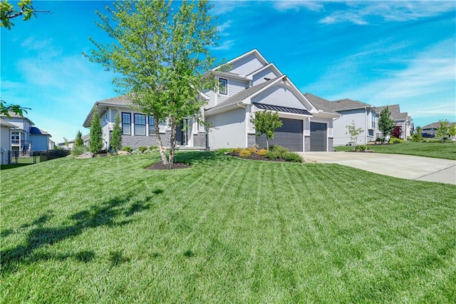 view of front of house with a garage, concrete driveway, stone siding, and a residential view