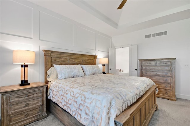 bedroom with light colored carpet, lofted ceiling, a ceiling fan, and baseboards