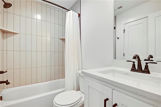 full bath featuring toilet, shower / bath combo with shower curtain, and vanity