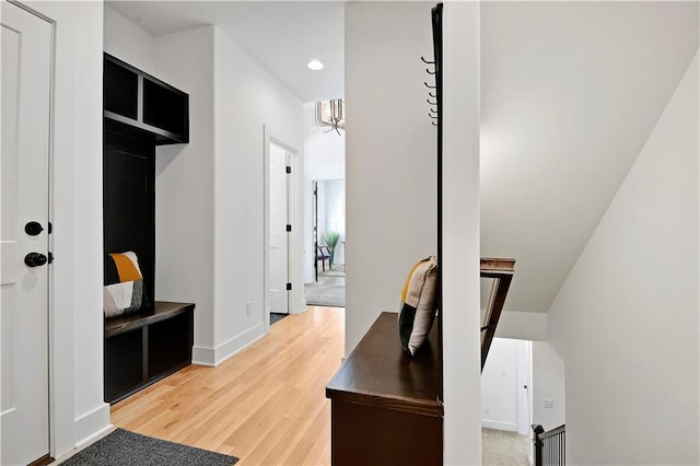 mudroom featuring a chandelier, recessed lighting, light wood-type flooring, and baseboards