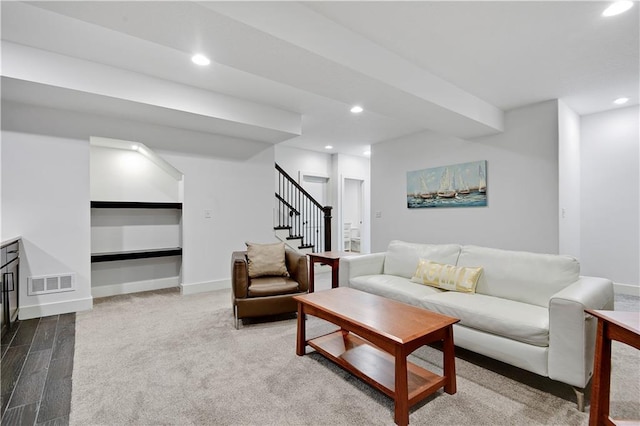 living room featuring stairway, recessed lighting, baseboards, and wood finished floors