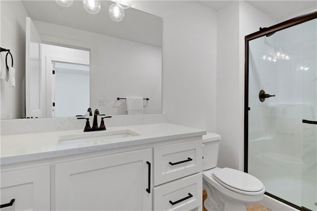 full bath featuring a shower stall, toilet, and vanity