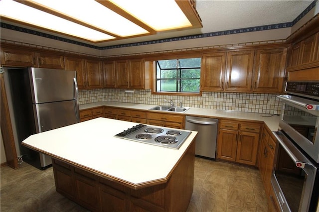 6726 Mill Creek Rd, Shawnee, KS 66217 - kitchen with stainless steel appliances, a sink, brown cabinets, and decorative backsplash