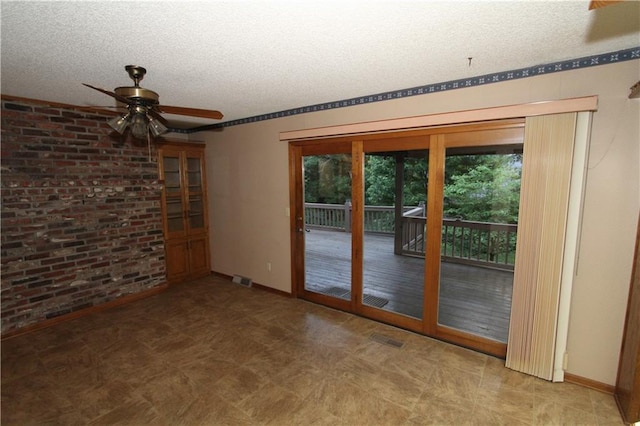6726 Mill Creek Rd, Shawnee, KS 66217 - spare room with a textured ceiling, ceiling fan, baseboards, and tile patterned floors