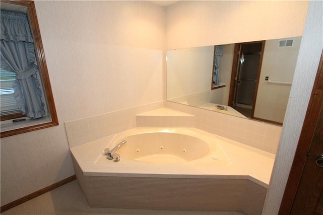 6726 Mill Creek Rd, Shawnee, KS 66217 - bathroom with a jetted tub and baseboards