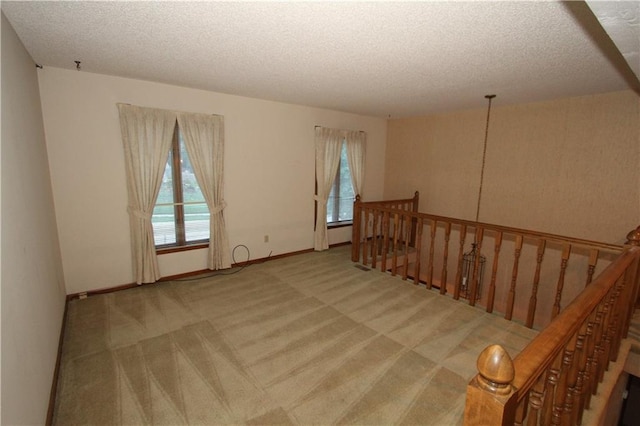 6726 Mill Creek Rd, Shawnee, KS 66217 - carpeted spare room featuring a textured ceiling