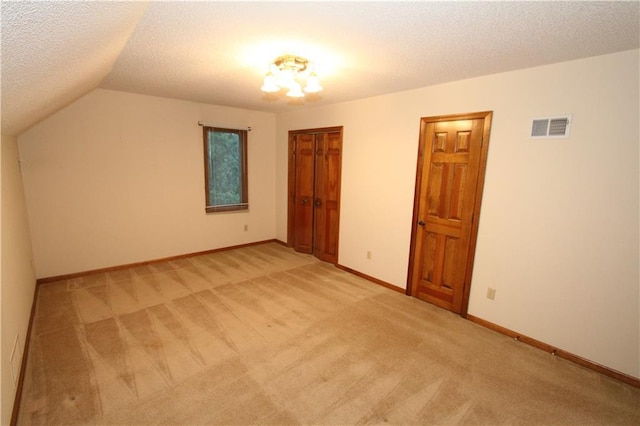 6726 Mill Creek Rd, Shawnee, KS 66217 - bonus room with light colored carpet, lofted ceiling, a textured ceiling, and baseboards