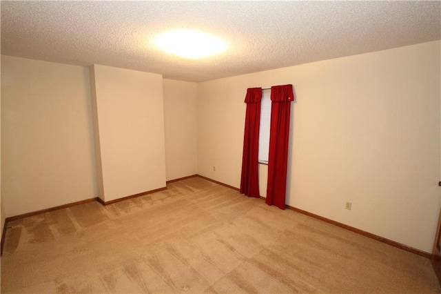6726 Mill Creek Rd, Shawnee, KS 66217 - spare room featuring light carpet, a textured ceiling, and baseboards
