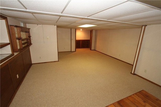 6726 Mill Creek Rd, Shawnee, KS 66217 - finished below grade area featuring baseboards, a paneled ceiling, and light carpet
