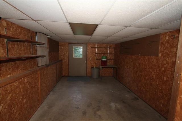 6726 Mill Creek Rd, Shawnee, KS 66217 - basement featuring a drop ceiling and wooden walls