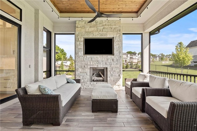 11201 W 169th St, Overland Park, KS 66221 - sunroom with a ceiling fan and an outdoor living space with a fireplace