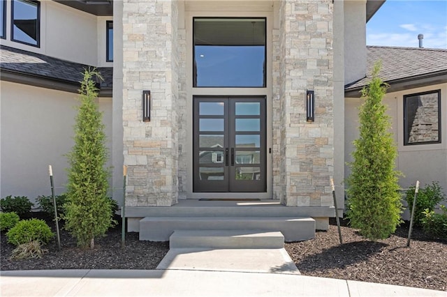 11201 W 169th St, Overland Park, KS 66221 - property entrance with french doors, stone siding, and stucco siding