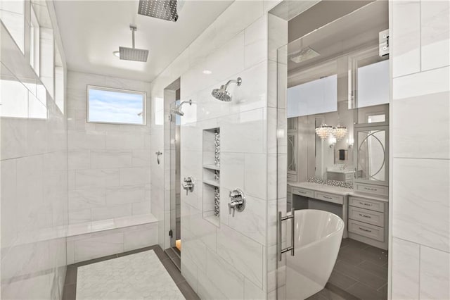 11201 W 169th St, Overland Park, KS 66221 - bathroom featuring a stall shower, a freestanding bath, vanity, tile walls, and tile patterned flooring
