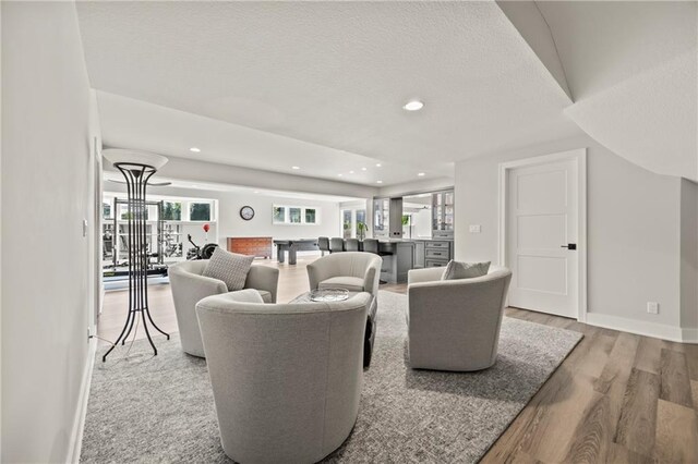 11201 W 169th St, Overland Park, KS 66221 - living room with light wood-style floors, baseboards, and recessed lighting