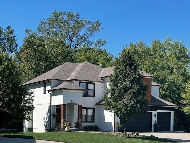 3536 SW Dana Ave E, Lees Summit, MO 64082 - view of front of house with concrete driveway, a front lawn, roof with shingles, and a garage