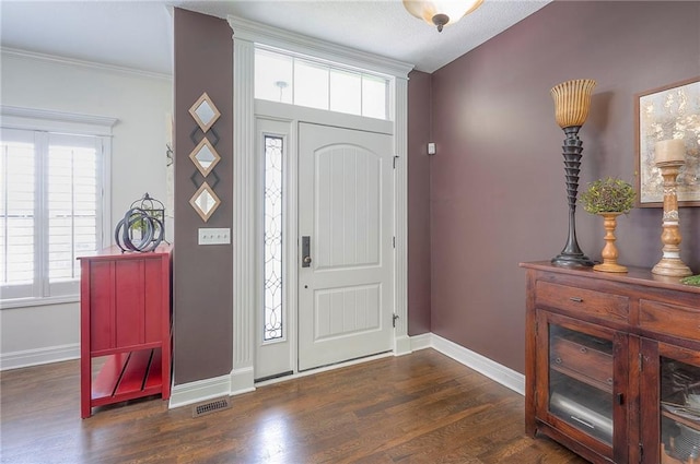 3536 SW Dana Ave E, Lees Summit, MO 64082 - foyer entrance with baseboards, plenty of natural light, wood finished floors, and crown molding