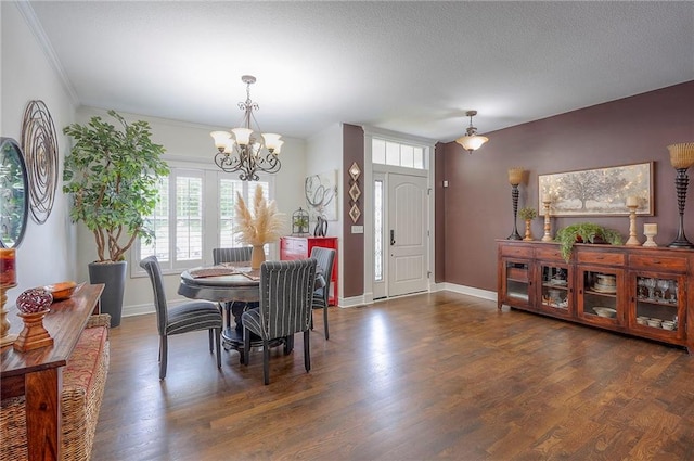 3536 SW Dana Ave E, Lees Summit, MO 64082 - dining space with a chandelier, wood finished floors, baseboards, and crown molding