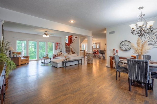 3536 SW Dana Ave E, Lees Summit, MO 64082 - living room with a chandelier, stairway, dark wood-style floors, ceiling fan, and recessed lighting