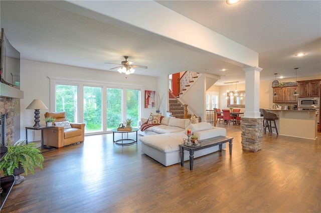3536 SW Dana Ave E, Lees Summit, MO 64082 - living area with stairs, dark wood-style floors, ceiling fan, a fireplace, and recessed lighting