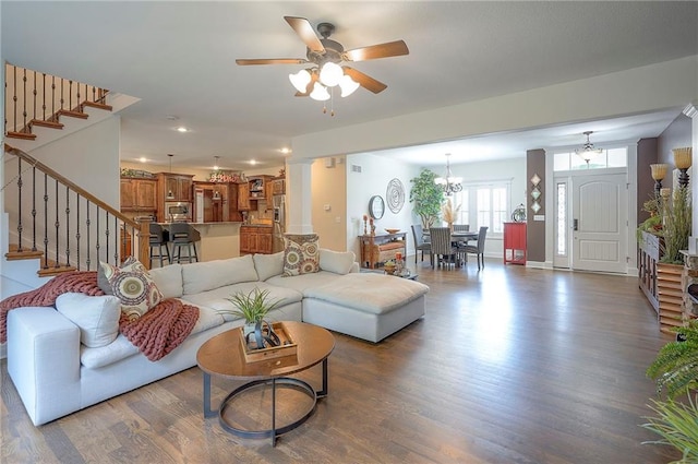 3536 SW Dana Ave E, Lees Summit, MO 64082 - living room with wood finished floors, stairs, ceiling fan, recessed lighting, and a chandelier