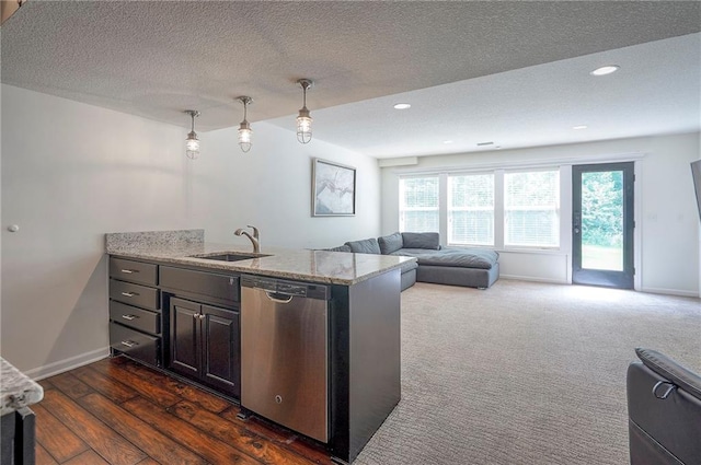 3536 SW Dana Ave E, Lees Summit, MO 64082 - kitchen featuring stainless steel dishwasher, a sink, light stone counters, a textured ceiling, and baseboards