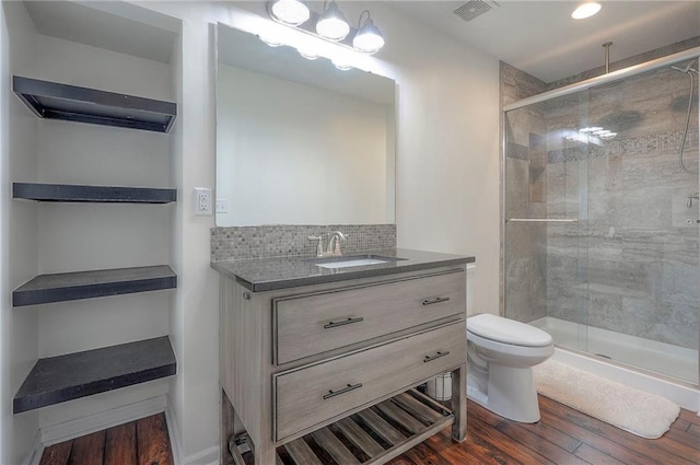 3536 SW Dana Ave E, Lees Summit, MO 64082 - full bath with toilet, wood finished floors, a stall shower, and vanity
