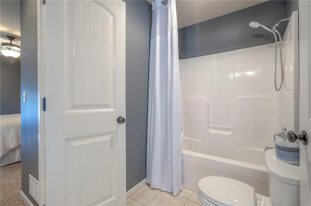 3536 SW Dana Ave E, Lees Summit, MO 64082 - bathroom featuring shower / bathtub combination with curtain, toilet, tile patterned floors, connected bathroom, and ceiling fan