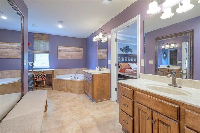 3536 SW Dana Ave E, Lees Summit, MO 64082 - ensuite bathroom featuring a garden tub, two vanities, and tile patterned flooring