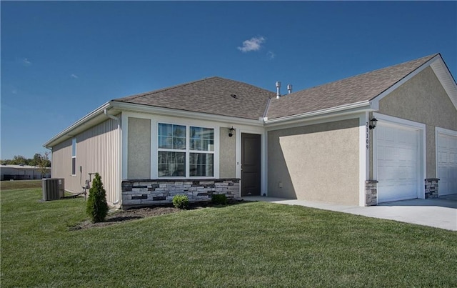 ranch-style house with a front lawn, stone siding, cooling unit, an attached garage, and driveway