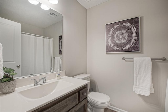 bathroom with vanity, visible vents, toilet, and a shower with curtain