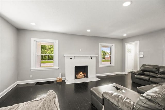 6101 Swope Pkwy, Kansas City, MO 64130 - living room featuring recessed lighting, a fireplace, and dark wood-style floors