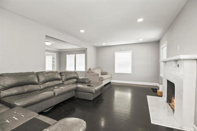 6101 Swope Pkwy, Kansas City, MO 64130 - living area with wood finished floors, a high end fireplace, healthy amount of natural light, and recessed lighting