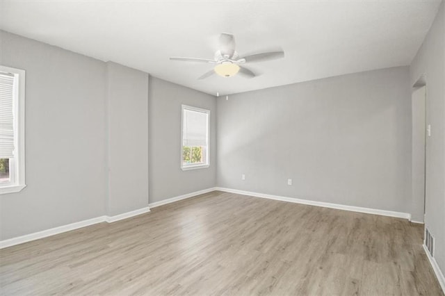 6101 Swope Pkwy, Kansas City, MO 64130 - spare room featuring wood finished floors and a ceiling fan