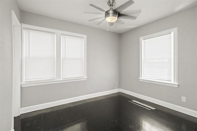 6101 Swope Pkwy, Kansas City, MO 64130 - spare room with dark wood-style flooring and ceiling fan