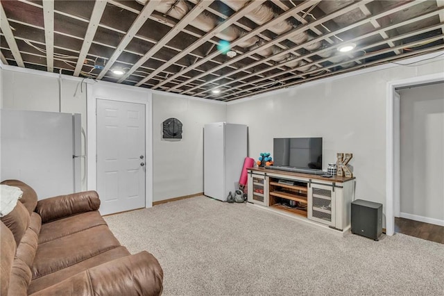 living room with carpet and baseboards