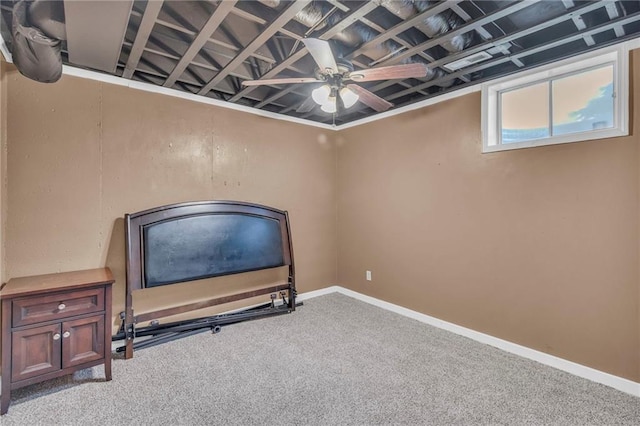 workout area featuring baseboards, carpet flooring, and ceiling fan