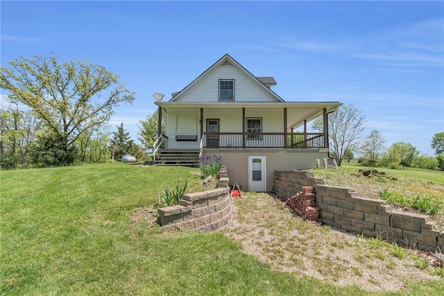 rear view of property with a porch and a lawn